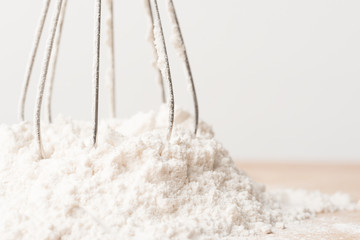 Flour and whisk prepare for cooking or baking