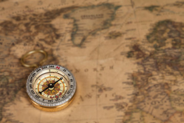 vintage compass on old map
