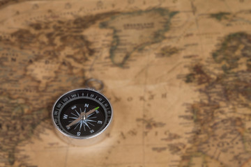 Fototapeta na wymiar vintage compass on old map
