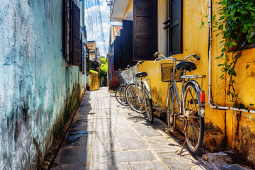 Bicycles parked near yellow wall, Hoi An Ancient Town