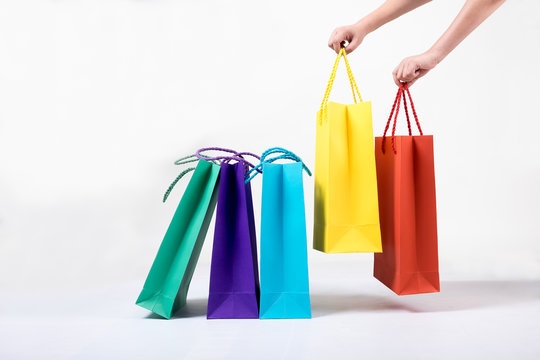 colourful paper shopping bags isolated on white