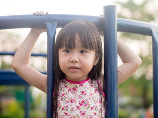 Fototapeta premium Happy kid, asian baby child playing on playground