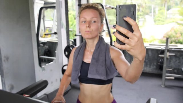 Sport Young Woman Taking Selfie with Smartphone in Gym