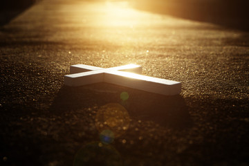 Cross on street and sunset background ,The way Christian believe