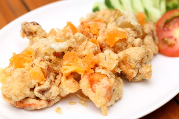 fried chicken with rice and vegetables on plate