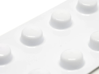 Blister pack of pills isolated on white background macro shot