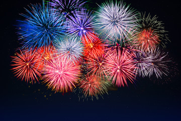 Amazing red, golden, blue fireworks over night sky