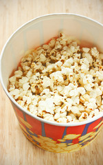Popcorn in big paper bucket
