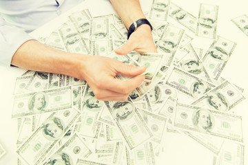 close up of male businessman hands with money