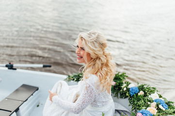 Fototapeta premium Beautiful young bride in luxury wedding dress