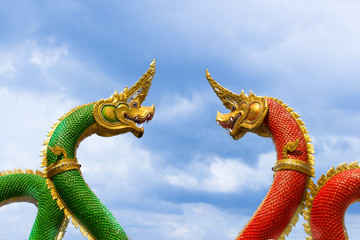 Green and red dragon with blue sky