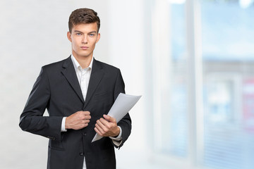 Busy businessman with loads of paperwork