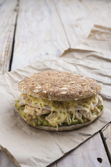 Sandwich with chickend and guacamole, cheese.