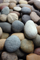 Fototapeta na wymiar colorful multicolored pebbles on seashore