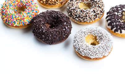 various donuts on white background