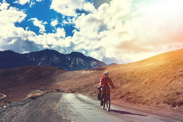 Fototapeta premium Cyclist standing on mountains road. Himalayas, Jammu and Kashmir State, North India 