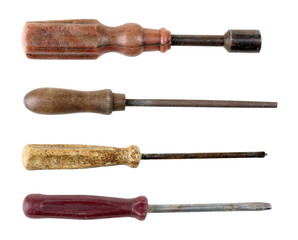 a collage of old screwdrivers and nail file on a white isolated background