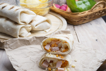 Breakfast burrito with eggs, cheddar, microgreens and roasted mu