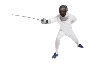 Man wearing fencing suit practicing with sword
