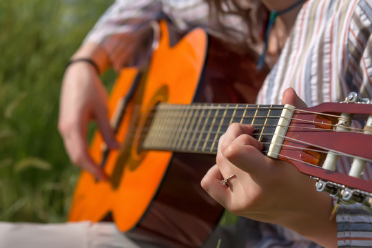 Hands of female Musician playing Gu
