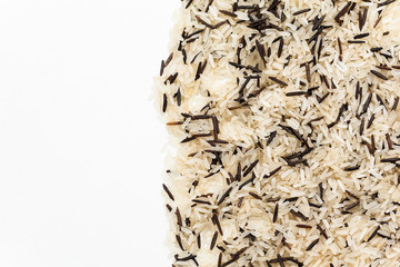 Heap of boiled mixed brown rice isolated on white