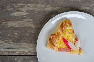Pizza Ham and Crab Sticks on white dish 