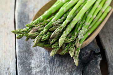 asparagus on wooden surface