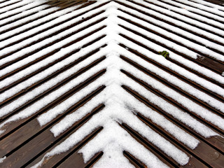 the snow on the wooden slats floor
