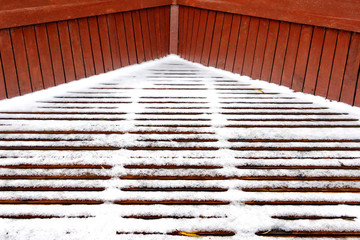 the snow on the wooden slats floor