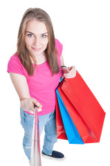 Beautiful smiling shopping lady doing self portrait with selfie