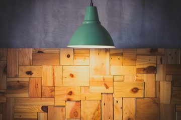wood wall room with ceiling lamp