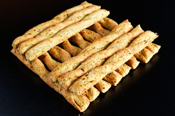 Curly bread sticks with onion and chives