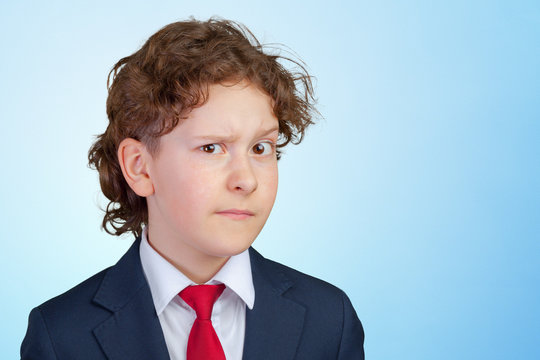 Closeup up portrait of s suspicious, cautious child boy