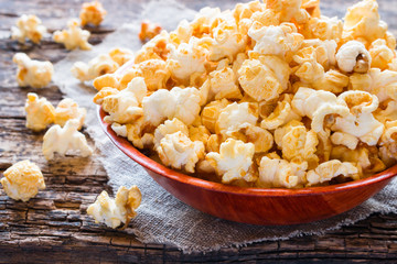 Plate with sweet popcorn on a napkin closeup