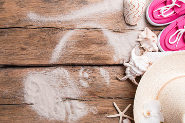 Cold water drink with ice and a slice of lime on wooden background