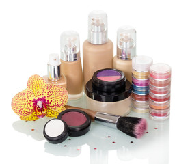 Obraz na płótnie Canvas Set of makeup, brush for makeup and orchid flower isolated.