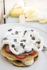 pancakes with strawberries, banana, blueberries and chocolate...