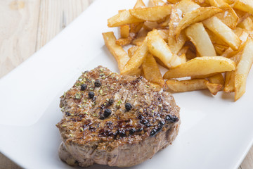 Rustic grilled beefsteak with french fries