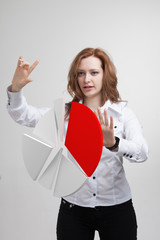 Woman shows a pie chart, circle diagram. Business analytics concept.