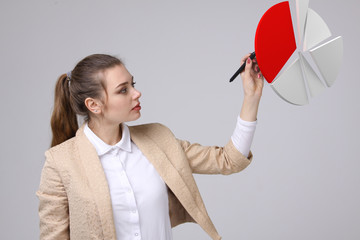 Woman shows a pie chart, circle diagram. Business analytics concept.
