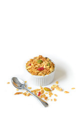 Homemade granola with honey, oatmeal, nuts raisin and cranberry on white background
