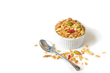Homemade granola with honey, oatmeal, nuts raisin and cranberry on white background
