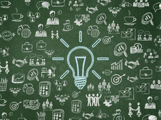 Finance concept: Light Bulb on School board background