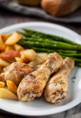 Roast chicken with potatoes and asparagus