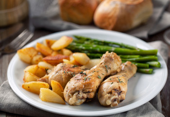 Roast chicken with potatoes and asparagus