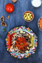 Iskender kebab - turkish food in traditional dishes, top view