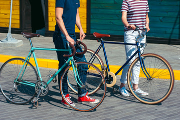 young couple going for a summer bicycle ride