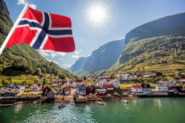 Beautiful Fishing village Undredal against mountain near the Flam in Norway - Powered by Adobe
