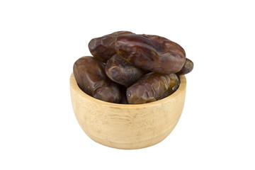 dried dates in the bowl on white background