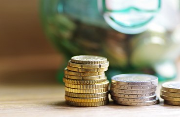 Coins. Euro money. Euro coin money with piggy on rustic background. Finance concept. Saving money concept.